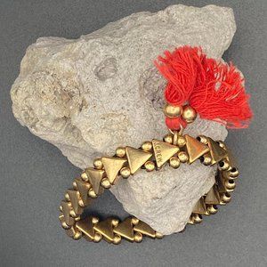 J Crew Gold Tone Triangle and Bead Stretch Bracelet with Red Tassles